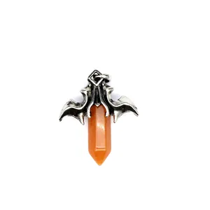 Gothic style silver bat wing pendant featuring a natural orange hexagonal crystal pillar