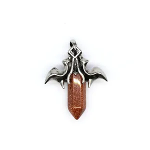 Detailed view of gothic dragon wing pendant with goldstone hexagonal crystal point