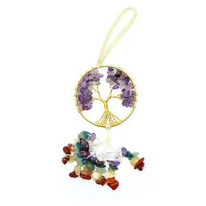 Detail view of the hand-woven chakra tree of life with colorful natural crystal stones.