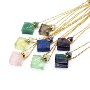 Variety of colorful natural crystal mini perfume bottle pendant necklaces in gold finish.