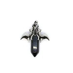 Close-up of gothic dragon wing pendant featuring a polished black hexagonal crystal