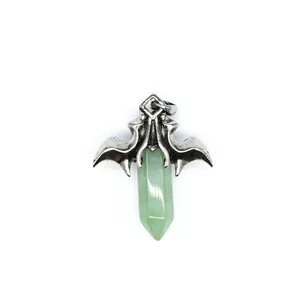 Silver-toned dragon wing pendant featuring a polished green hexagonal crystal pillar