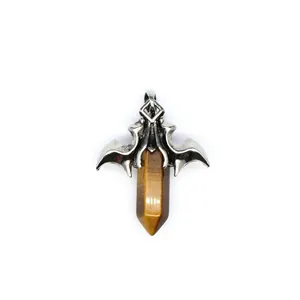 Detailed view of the vintage silver dragon wing pendant with a tiger eye crystal