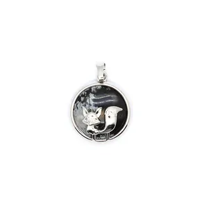 Detailed view of an elegant fox silver pendant featuring snowflake obsidian inlay