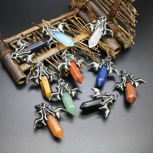 Detailed view of various hexagonal crystal pendants with gothic dragon wing caps