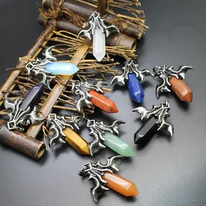 Variety of hexagonal crystal pendants with gothic bat dragon wing frames in different stones