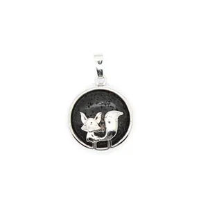 Detailed close-up of silver fox pendant with natural black volcanic lava stone base