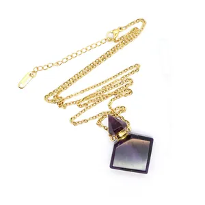 Detailed view of rainbow fluorite perfume bottle pendant with gold chain and dropper.
