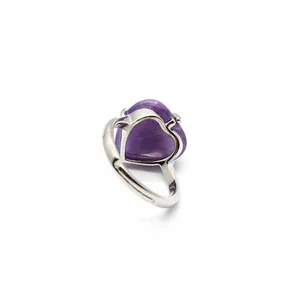 Detailed macro view of a heart-shaped purple natural stone ring with adjustable band