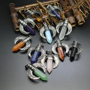 Detailed view of various hexagonal crystal pillar pendants with dragon wing design.