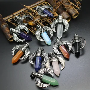 Close-up detail of crescent wing hexagonal crystal pendants in various natural stone types