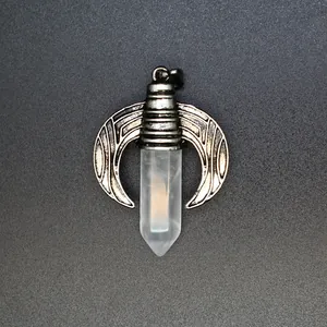 Detailed view of hexagonal white crystal pillar pendant with crescent wing mount.