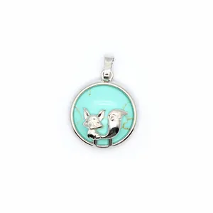Detailed view of a circular silver fox pendant necklace with turquoise-style stone inlay