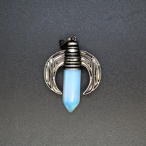 Detailed view of a hexagonal opalite crystal pendant with vintage dragon wing design.