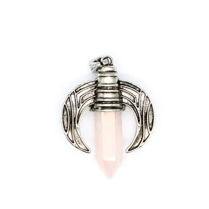 Close-up macro detail of men's flying dragon necklace with pink hexagonal crystal point