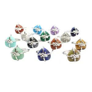 Collection of heart-shaped natural stone rings featuring tiger eye and lapis lazuli gemstones