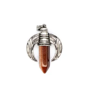 Detailed view of a silver dragon wing pendant with a brown goldstone hexagonal point.
