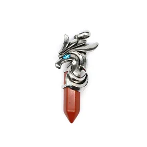 Macro view showing the intricate silver dragon pendant with red jasper hexagonal pillar