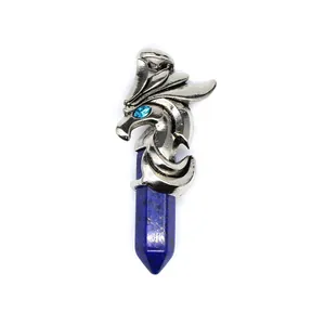 Close-up detail of dragon head pendant with blue rhinestone eye and lapis lazuli crystal