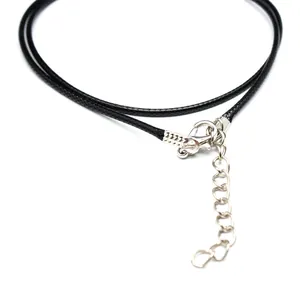 Detail view of silver lobster clasp and extension chain on black cord necklace