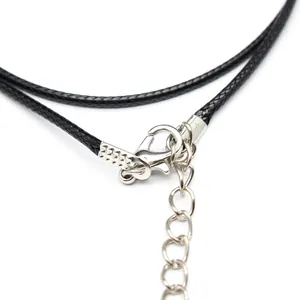 Macro detail of 2mm black cord necklace with silver lobster clasp and extension chain