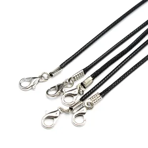Close-up of 2mm black wax cord necklaces with silver lobster clasps and extenders