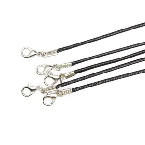 Detail view showing 2mm black wax cord necklaces with silver-toned lobster clasps.