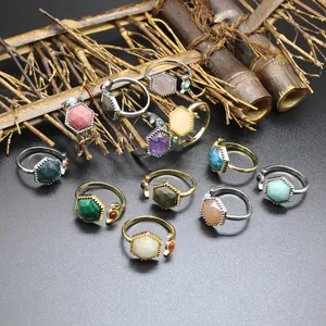 Detailed macro view of hexagonal natural stone crystal rings with adjustable open bands.