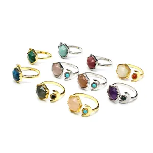 Detailed macro view of bohemian hexagonal crystal open rings with celestial moon motifs