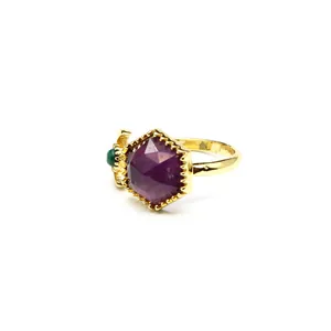 Close-up of elegant hexagram purple crystal ring with gold plated adjustable open band