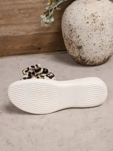 Bottom view of leopard bow flat sandal showing non-slip sole texture and size 37 mark