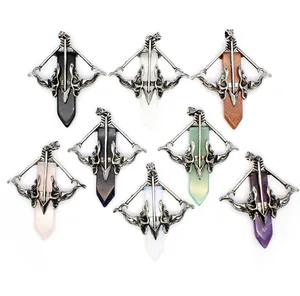 Detail view of multiple Cupid's Sword crystal pendants with various colored stones.