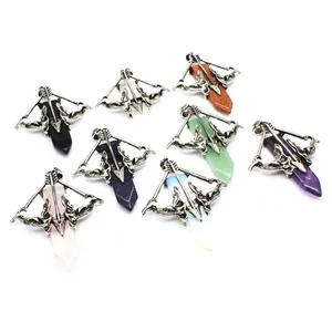 Close-up of Cupid's arrow crystal pendants in various colorful gemstones