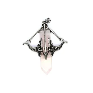 Close-up detail of Cupid's bow and arrow wrapped around a pink rose quartz crystal