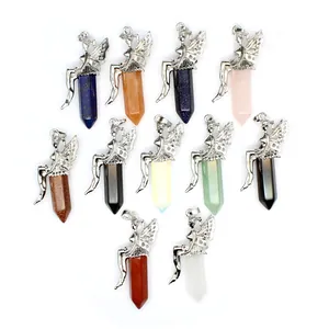 Macro view of various hexagonal stone pendants featuring intricate silver fairy decorations