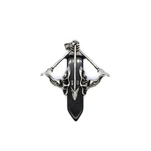 Detailed view of Cupid's arrow crossbow pendant with a black hexagonal stone point.