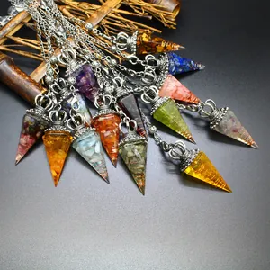 Detailed view of hexagonal resin crystal pendants with crushed stones and crown caps
