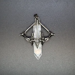 Macro detail of antique silver Cupid's bow and arrow crystal pendant necklace accessory