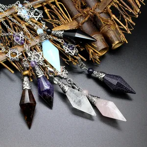 Detailed view of assorted natural crystal pendulums featuring silver hexagram charms