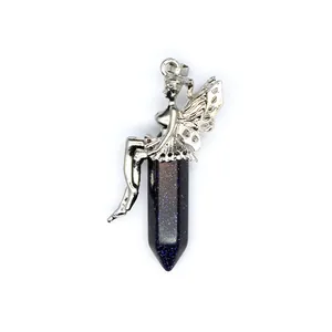 Detailed macro view of an antique silver fairy pendant on a blue goldstone pillar
