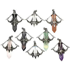 Collection of Cupid's bow and arrow pendants with various natural crystal stones.