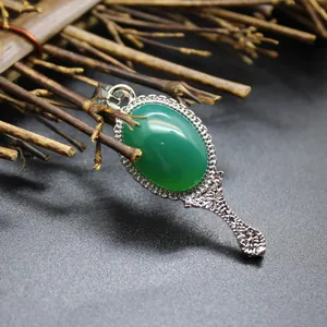 Vintage silver magic mirror pendant with oval green chalcedony stone