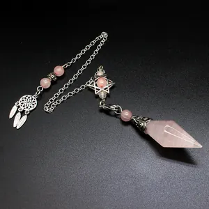 Rose quartz crystal dowsing pendulum with dreamcatcher and hexagram charms detail