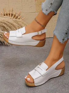 Detailed view of white platform wedge sandals for women with open toe and adjustable strap