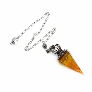 Amber resin crystal pendulum featuring silver crown cap and plated chain detail