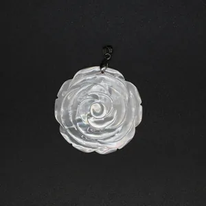Detailed macro view of the iridescent white mother-of-pearl carved rose flower pendant.