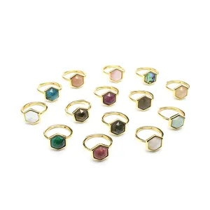 Collection of various hexagonal natural stone rings with adjustable gold-plated bands.
