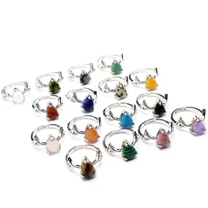 Detail view of variety of colorful teardrop gemstone rings with antler silver bands.