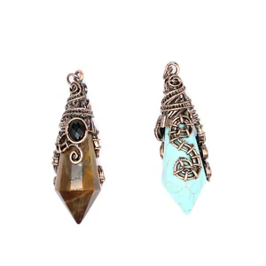 Detail of wire-wrapped witch hat style crystal point pendants in tiger eye and turquoise