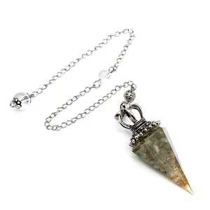 Macro detail of hexagonal crystal resin pendulum with crown top and silver chain link
